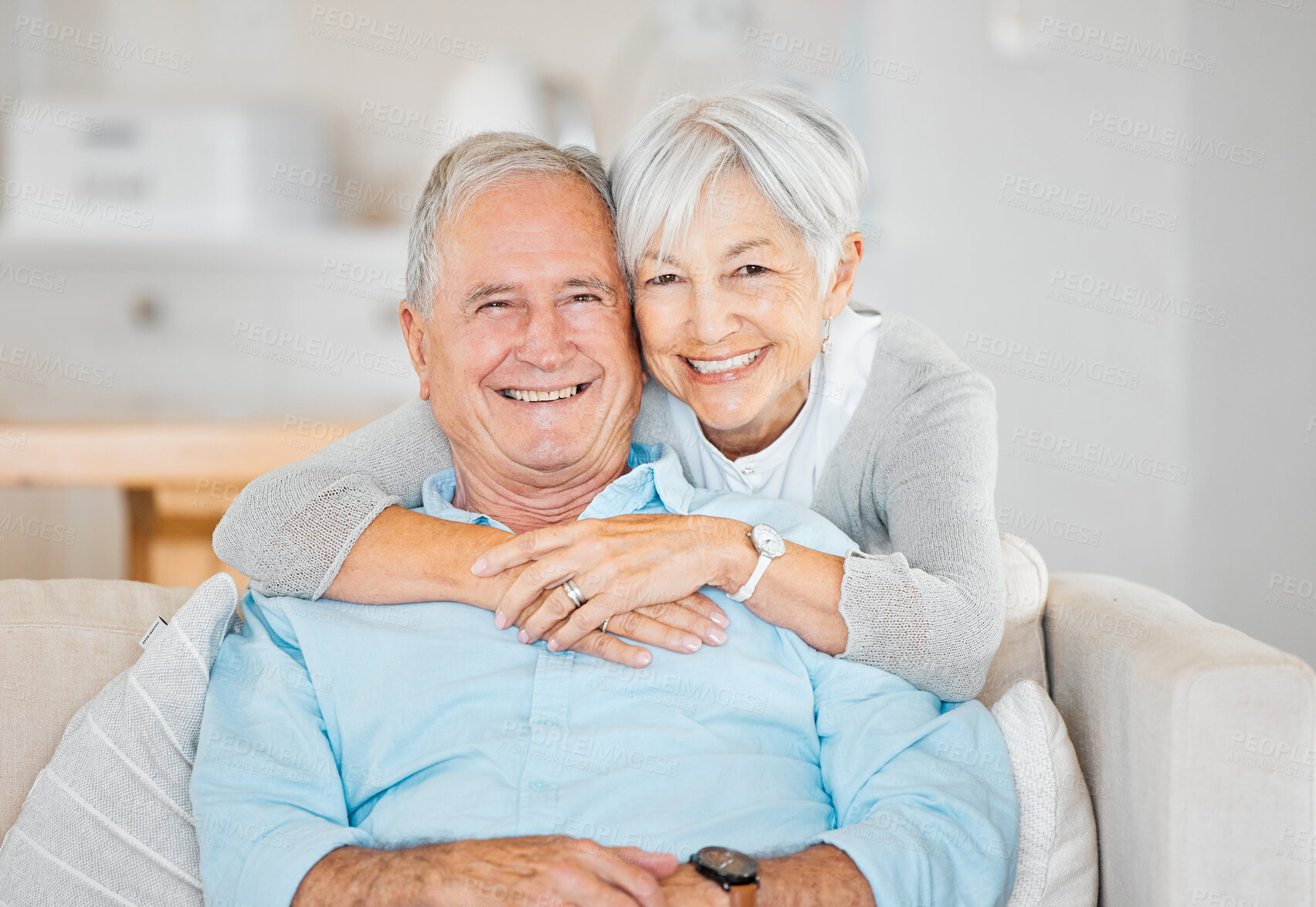 Buy stock photo Hug, portrait and smile with senior couple on sofa in living room of home for love or retirement. Safety, security or trust with happy mature man and woman in apartment for bonding or marriage