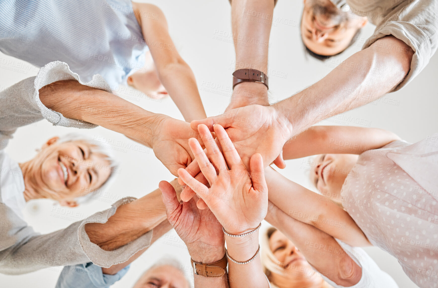 Buy stock photo Low angle, hands and stack with family for support, bonding together and connection for relationship. Home, people and happy with huddle for solidarity, generations and trust for motivation by below