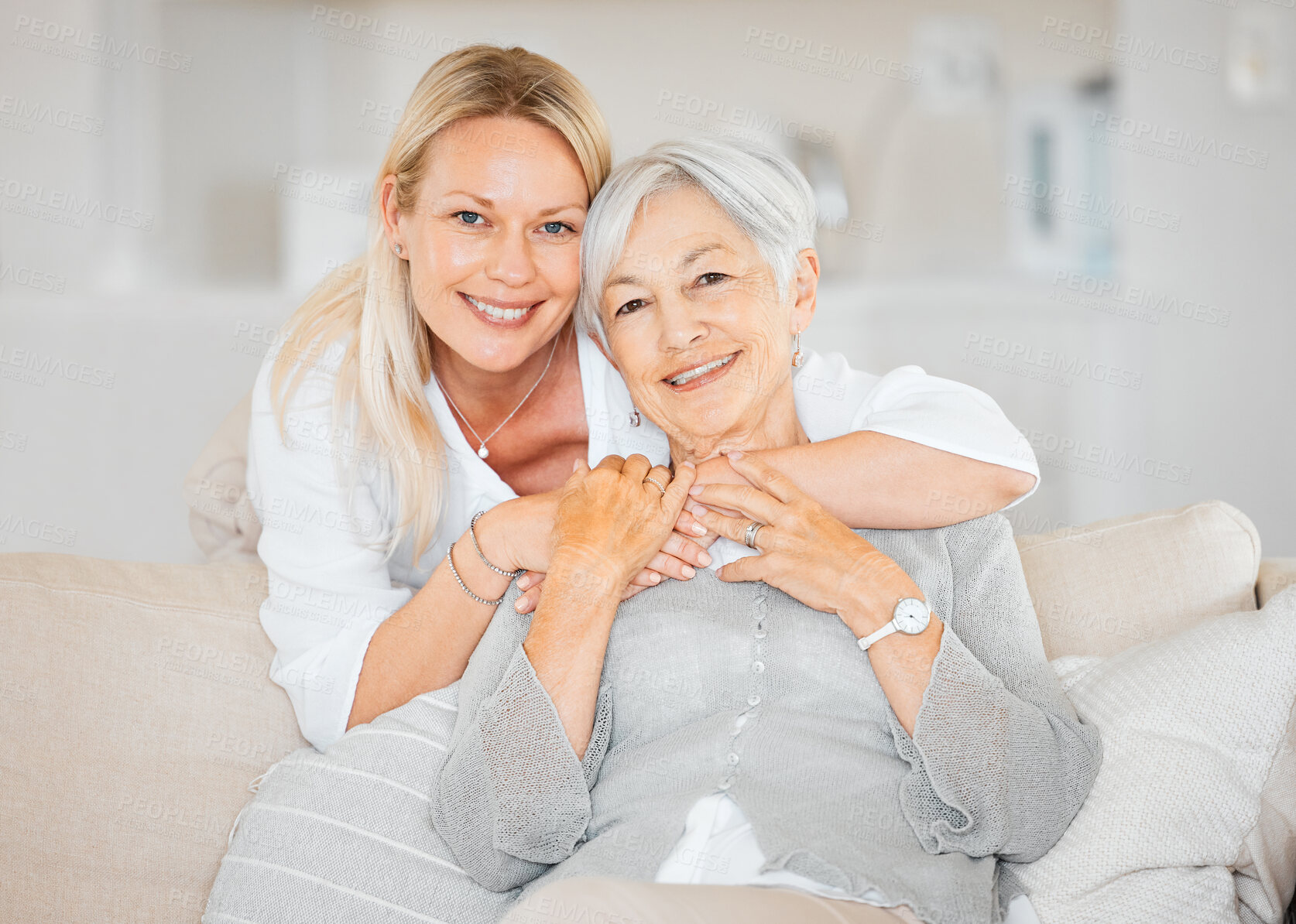 Buy stock photo Senior woman, daughter and hug in portrait for bonding, sofa and relax in home on weekend with love. Elderly person, family and happy together on couch in living room for support, care and embrace
