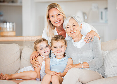 Buy stock photo Shot of two little girls spending time with their mother and grandmother at home