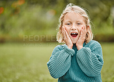 Buy stock photo Shot of an adorable little girl looking surprised while standing outside