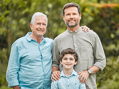 Buy stock photo Shot of a boy standing outside with his father and grandfather