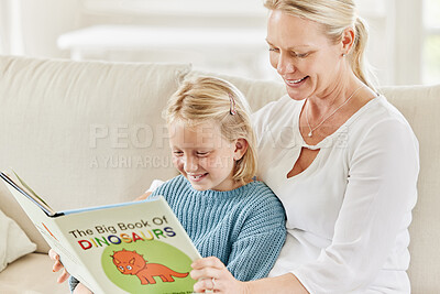 Buy stock photo Teaching, happy girl and mother reading book on couch for learning, bonding and education in home together. Smile, family and mom with kid for storytelling, fantasy fairytale or child development