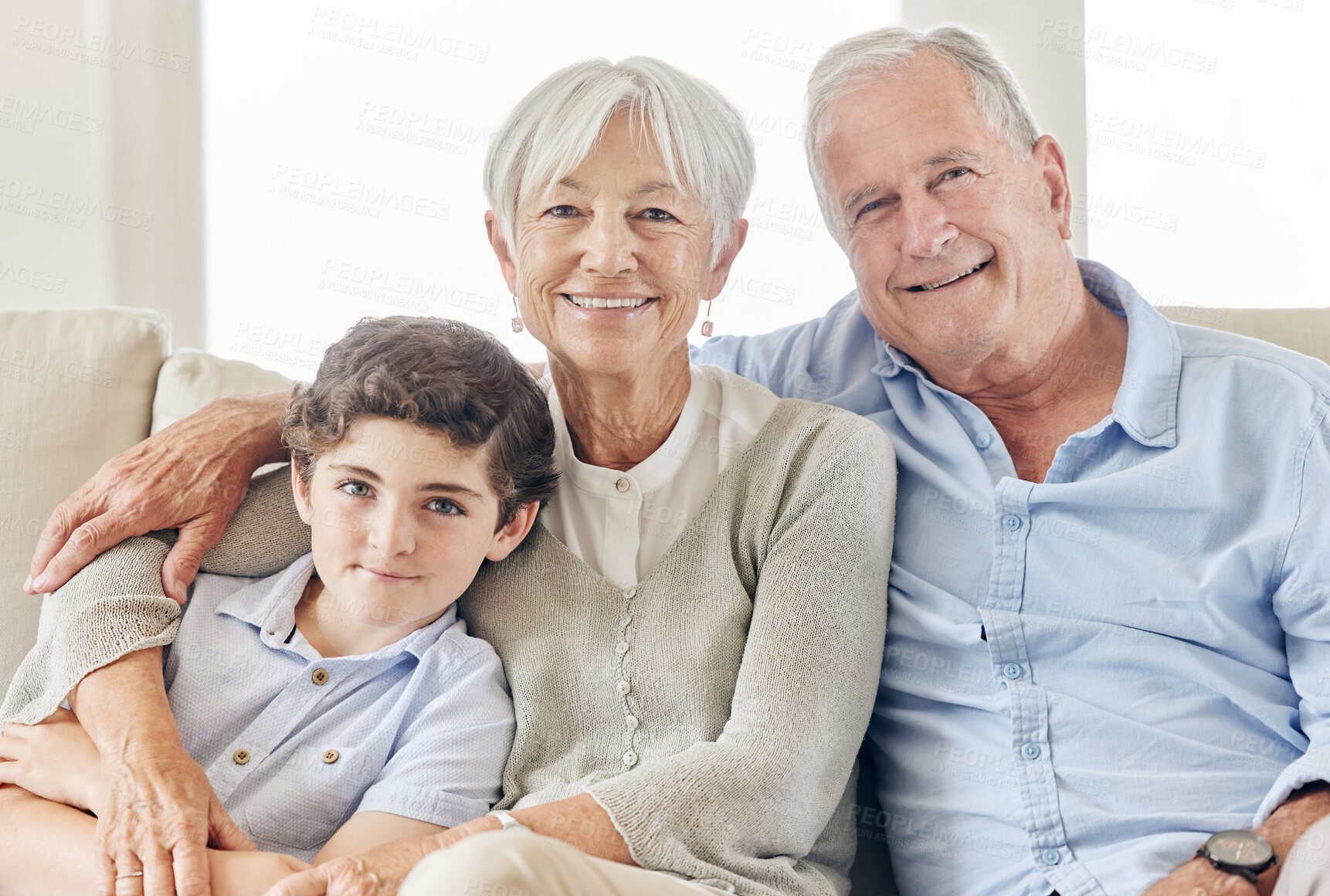 Buy stock photo Family, grandparents and boy in home portrait, happy and old people in hug for bonding on couch. Together, grandma and grandpa with kid in embrace for love, Berlin and support in connection on sofa