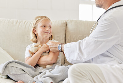 Buy stock photo Shot of a male doctor injecting a little girl at home