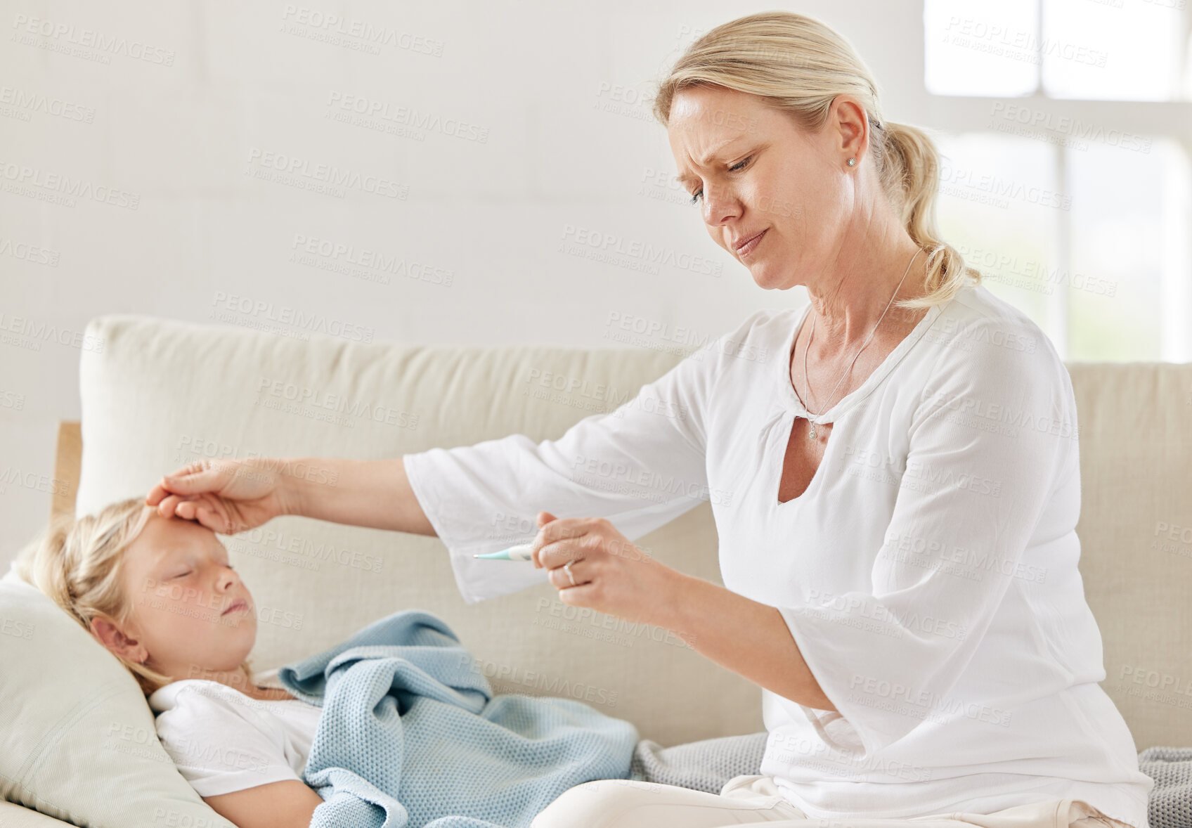 Buy stock photo Mother, child and thermometer for symptoms, fever and cold virus in living room with concern or care. Woman, daughter and sick in home with hand on forehead, check and wellness for medical condition