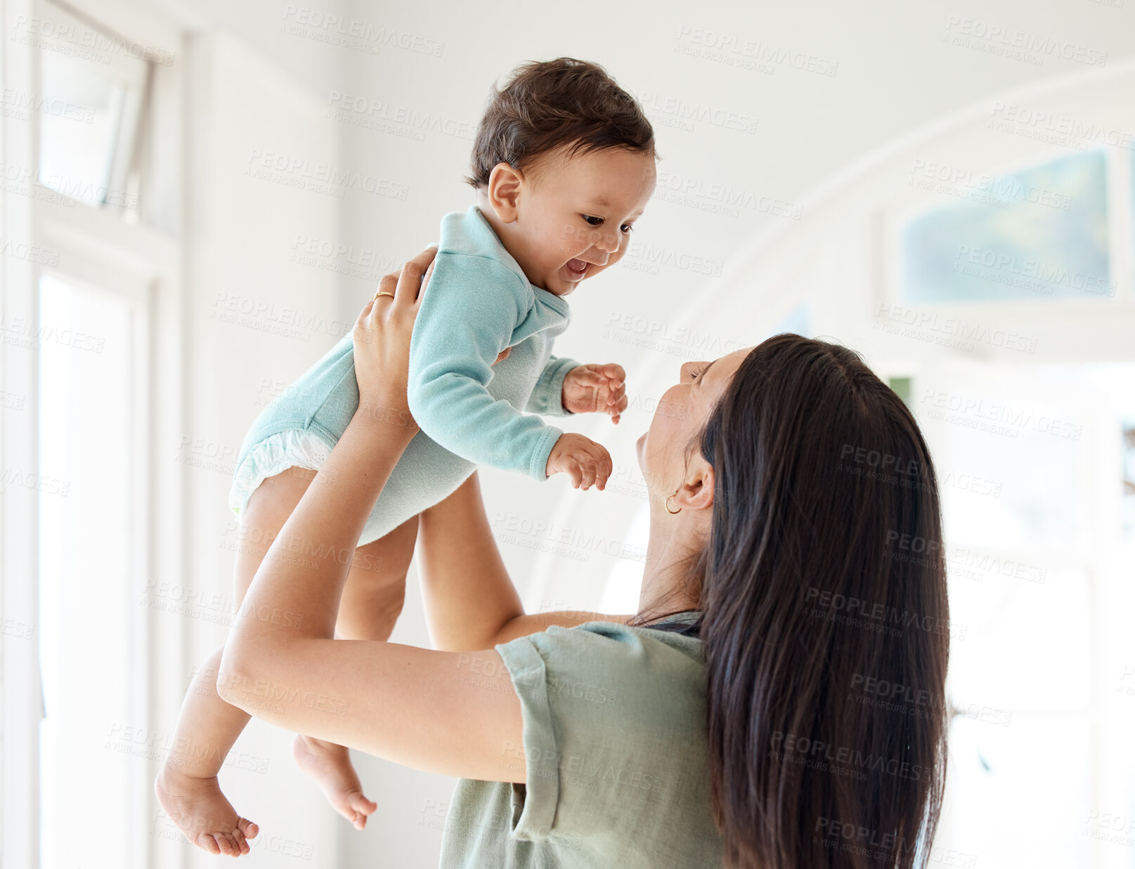 Buy stock photo Mom carrying happy baby in home for love, care and quality time together to nurture childhood development. Mother, playing and holding infant kid for support, happiness and funny laughing in house
