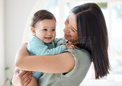 Buy stock photo Mother holding happy baby in home for love, care and quality time together to nurture childhood development. Mom, infant kid and carrying little girl for support, happiness and smile with fun parent