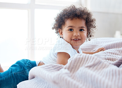 Buy stock photo Portrait, toddler girl and smile in bedroom for happiness, childhood development and growth with curly hair. Cute, adorable and sweet young child, happy kid and relax in comfortable nursery at home