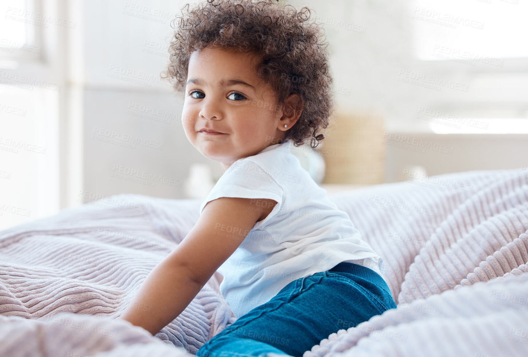 Buy stock photo Happy portrait, girl and kid in bedroom for fun, childhood development and baby growth with curly hair. Cute, adorable and sweet toddler, young child or relaxing on comfortable bed in nursery at home