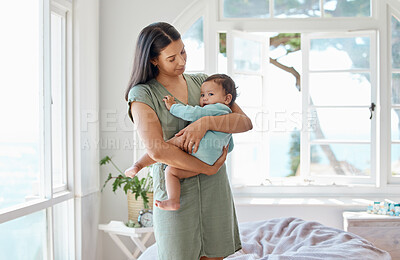 Buy stock photo Mother, baby and holding kid in home for love, care and quality time together for childcare, growth and development. Mom, infant and carrying newborn girl in arms for support, comfort or nursery room