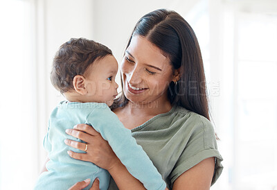 Buy stock photo Smile, mother and holding baby in home for love, care and quality time together for childcare, development and growth. Mom carrying infant kid, newborn girl and support of comfort, bond and happiness