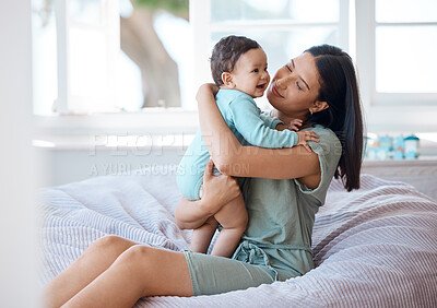 Buy stock photo Mother holding happy baby in home for love, support and quality time together for childhood growth. Mom, playful infant and relax with newborn girl on bean bag in kids nursery room with happiness