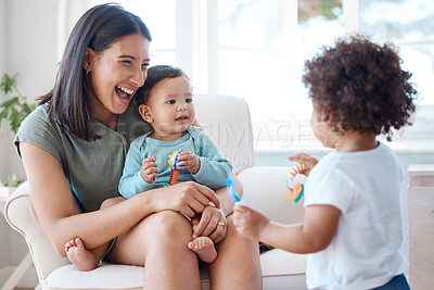 Buy stock photo Shot of a mother bonding with her two children at home
