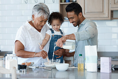 Buy stock photo Shot of an adorable little girl baking with her father and grandmother at home