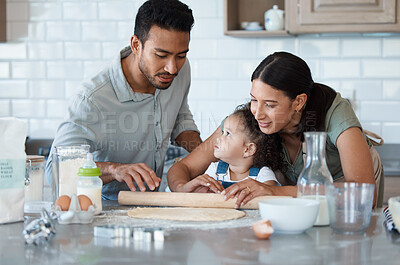 Buy stock photo Family, kid and learning baking with rolling pin for dough, flour or bonding with toddler in kitchen. Mom, dad and child cooking with parents, help or teaching girl dessert recipe for support in home