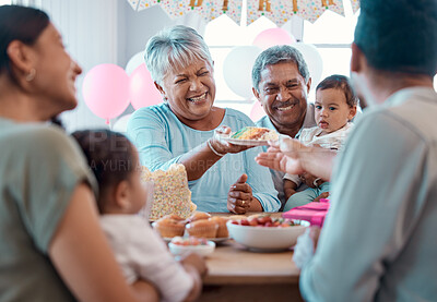 Buy stock photo Shot of a family celebrating a birthday together at home