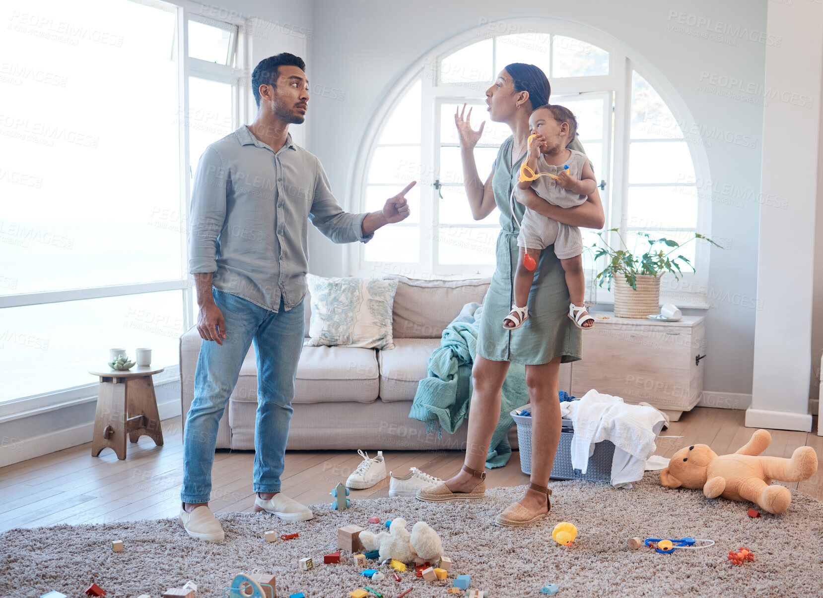 Buy stock photo Frustrated couple, fight or disagreement with baby for breakup, divorce or argument in living room dispute. Upset, man or woman with child for toxic relationship, conflict or cheating affair at home