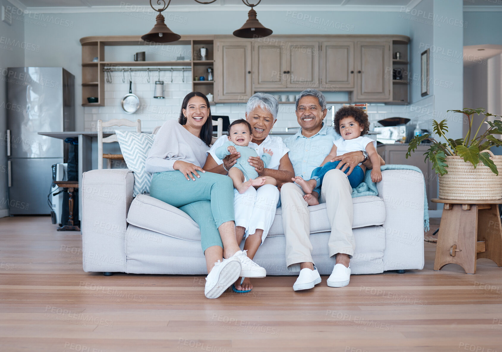 Buy stock photo Relax, smile and portrait of big family on sofa for bonding, care and support. Love, happiness and generations with senior man and woman holding children on couch in living room of home together