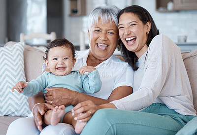 Buy stock photo Shot of a mature woman bonding with her granddaughter and daughter on the sofa at home