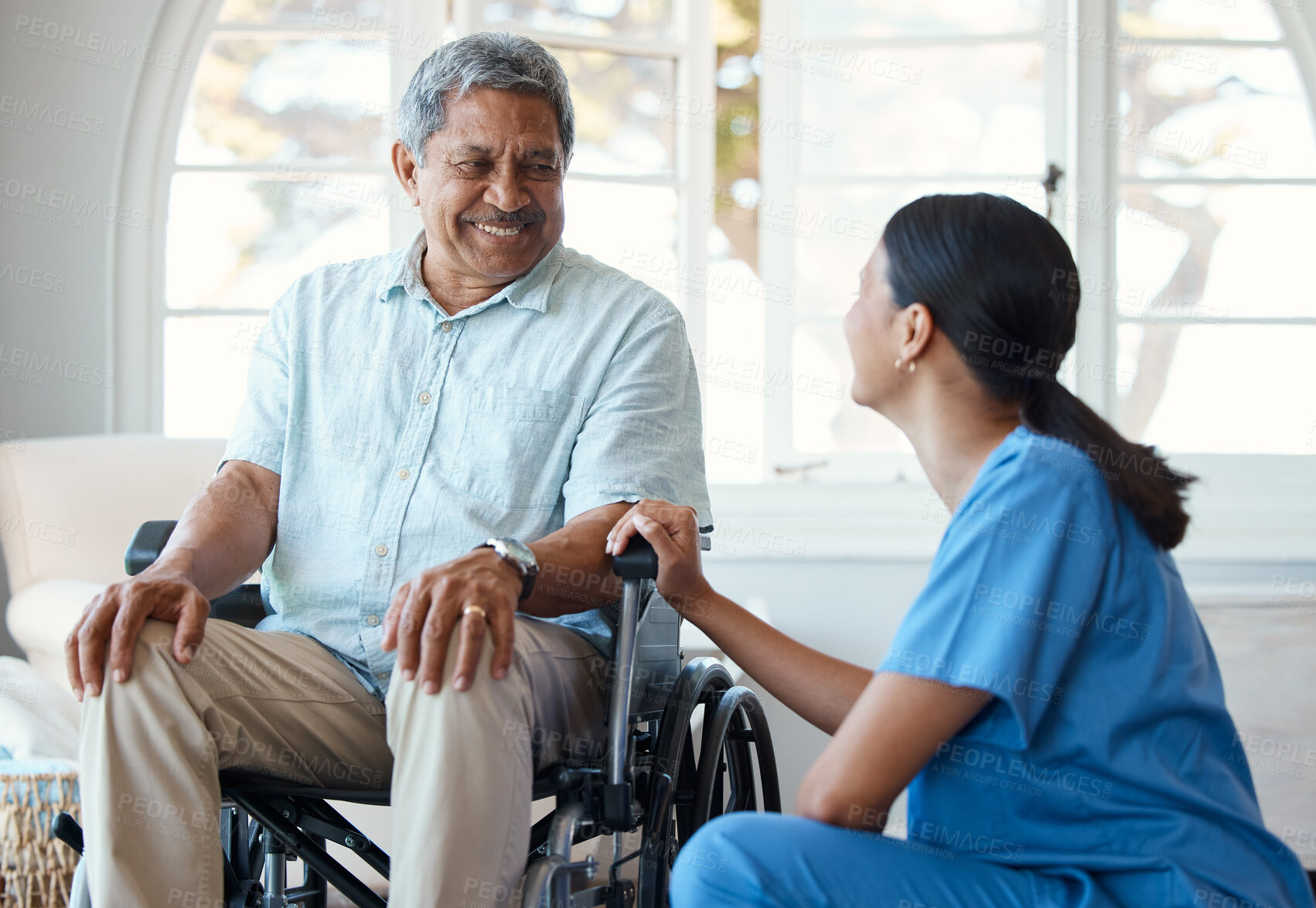 Buy stock photo Nurse, man with a disability and smile for wheelchair, healthcare and support with assisted living. Women, caregiver and empathy for homecare service, discussion and rehabilitation with senior care