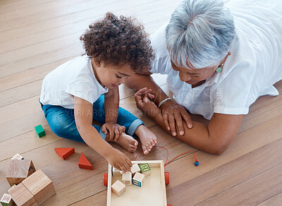 Buy stock photo Shot of a little girl playing with her grandmother at home