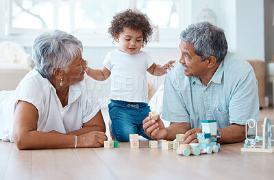 Buy stock photo Shot of a little girl playing with her grandparents at home