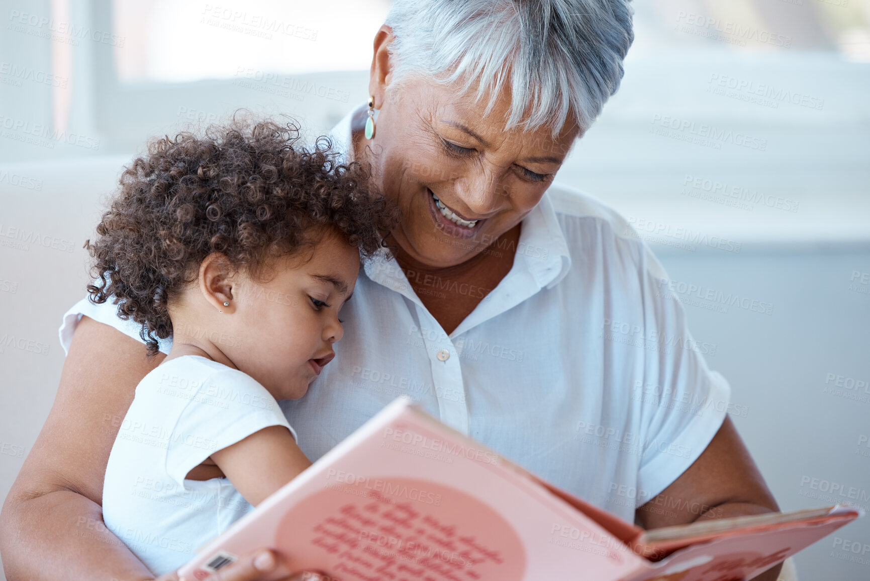 Buy stock photo Family, girl and grandmother reading a book, story and quality time with happiness, bonding and fairy tale. Granny, female grandchild or kid with fun, literature or learning to read at home and relax