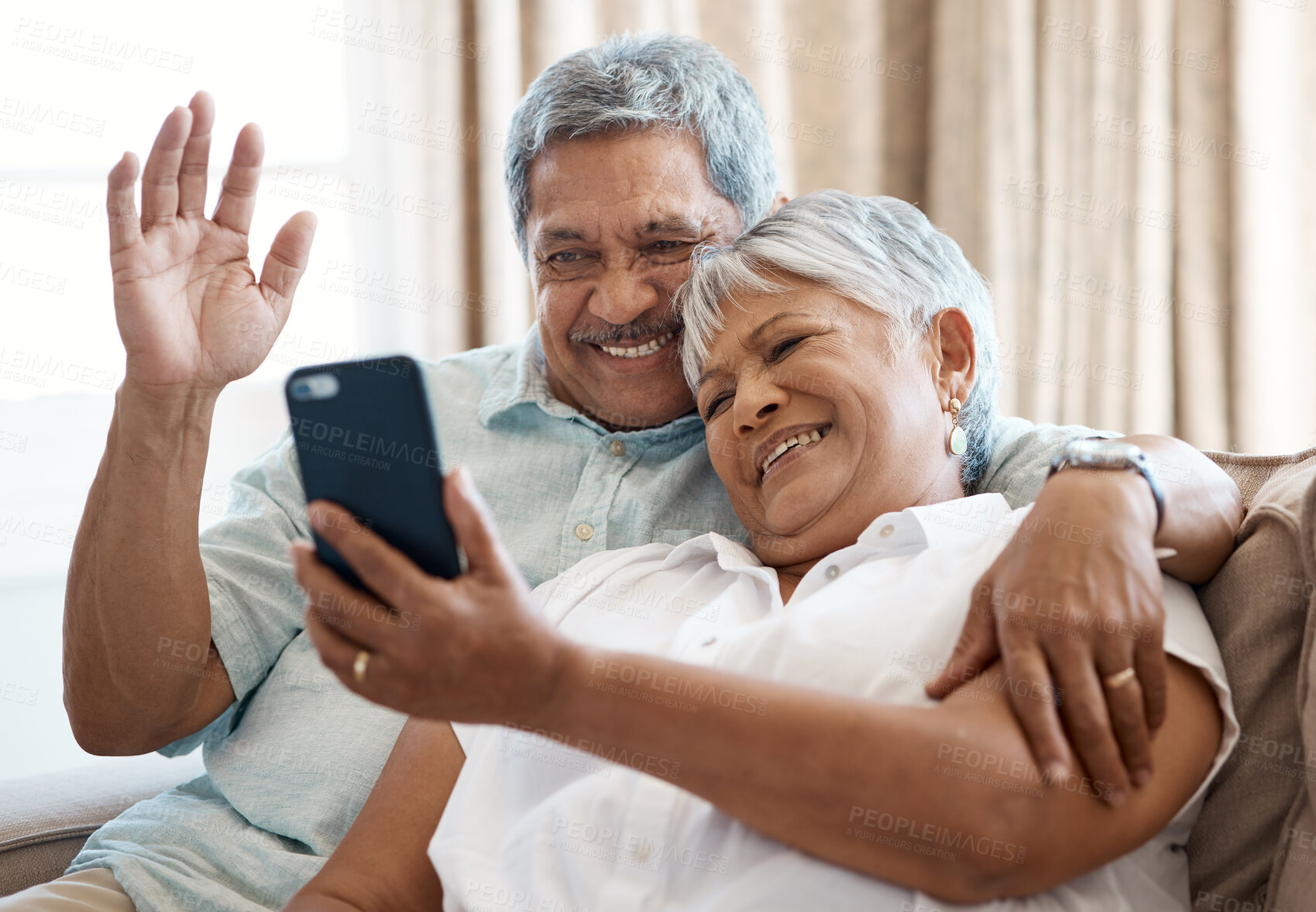 Buy stock photo Shot of a senior couple on a call together at home