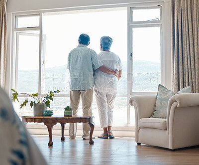 Buy stock photo Rearview angle shot of a senior couple relaxing spending time together at home