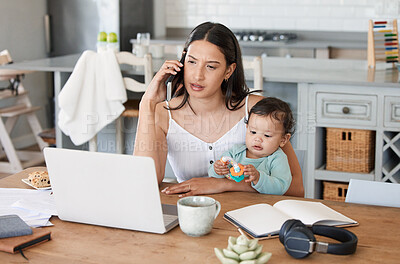 Buy stock photo Shot of a woman talking on her cellphone while sitting with her laptop and her baby on her lap