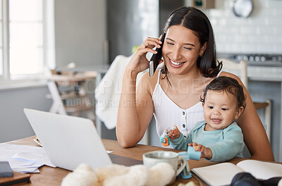Buy stock photo Shot of a woman talking on her cellphone while sitting with her laptop and her baby on her lap