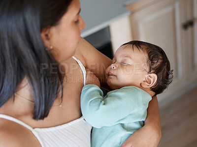 Buy stock photo Shot of an adorable baby girl sleeping in her mother's arms