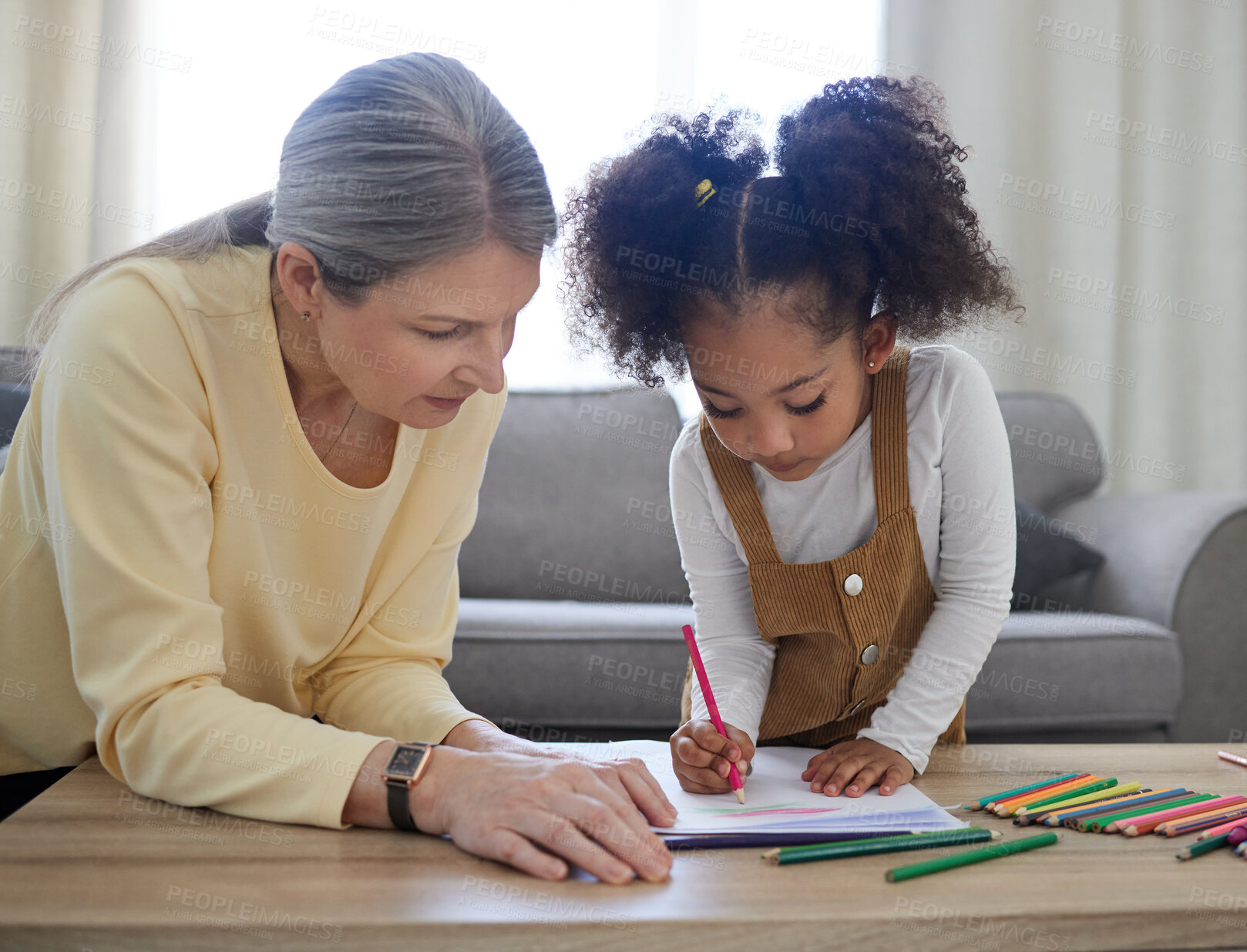 Buy stock photo Shot of a little girl drawing in a psychologists office