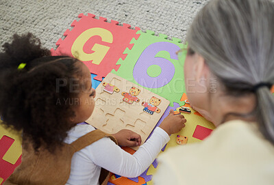 Buy stock photo Shot of a little girl playing with toys in her therapists office