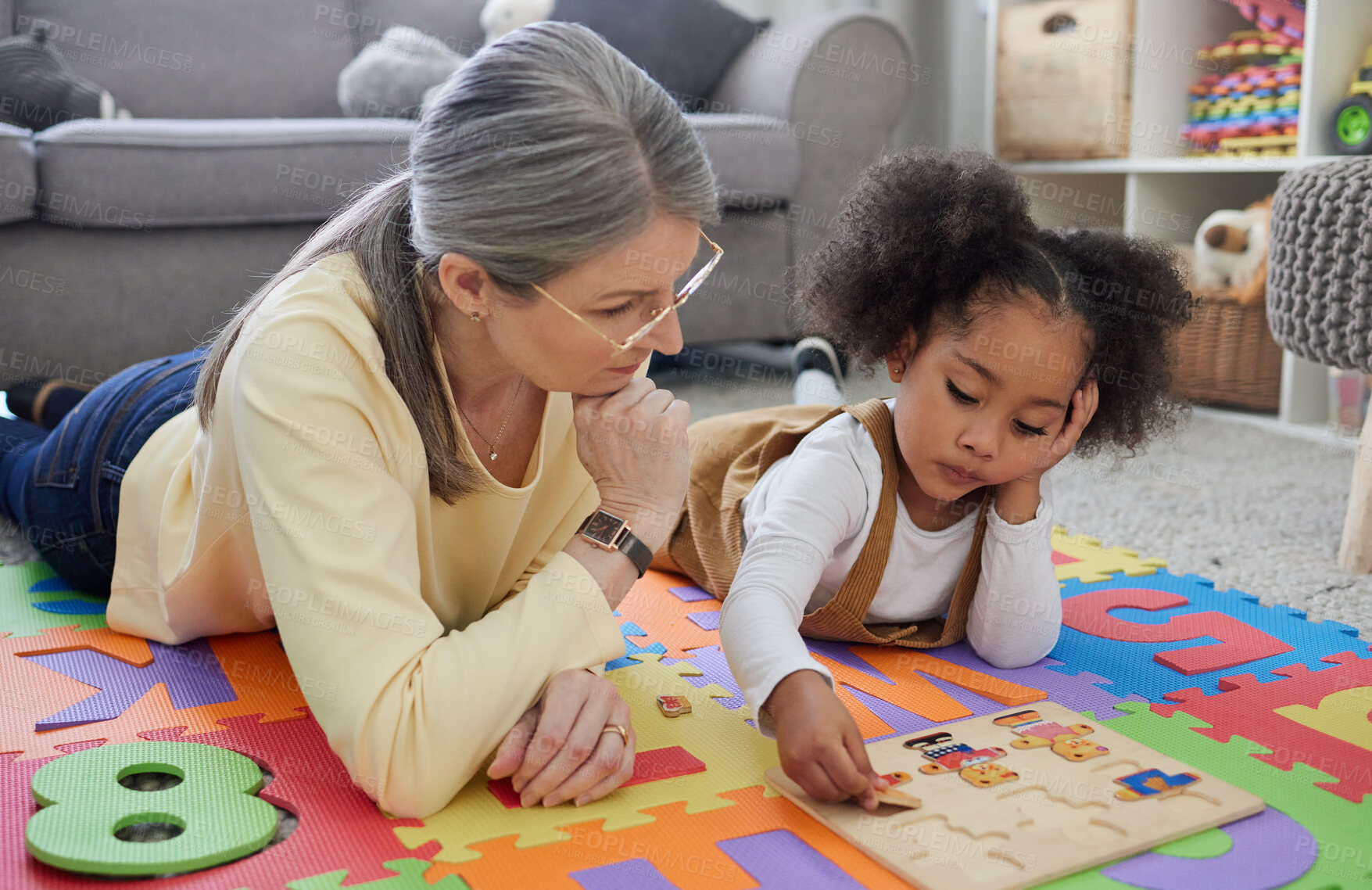 Buy stock photo Shot of a little girl playing with toys in her therapists office