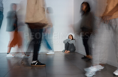 Buy stock photo Shot of a young woman sitting on the floor with people around her