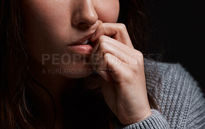 Buy stock photo Cropped shot of a woman biting her fingernails