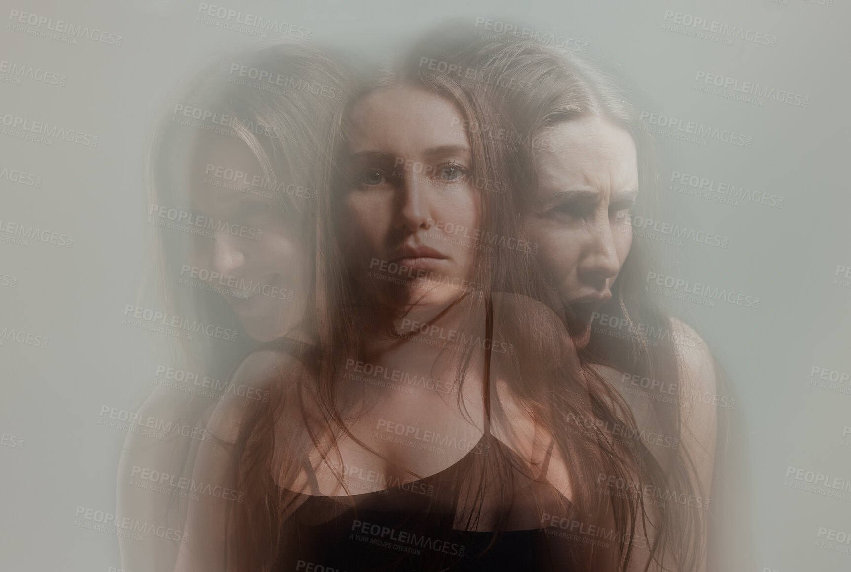 Buy stock photo Studio shot of a young woman experiencing mental anguish