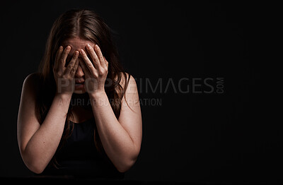Buy stock photo Shot of a woman standing with her hands over her face