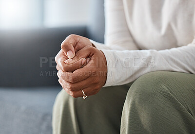 Buy stock photo Cropped shot of an unrecognisable woman sitting alone and feeling anxious during therapy