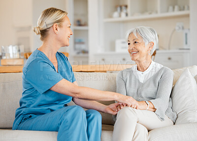 Buy stock photo Shot of a nurse caring for a senior woman at home