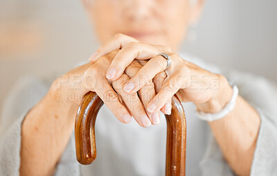 Buy stock photo Closeup shot of a senior woman holding a walking stick