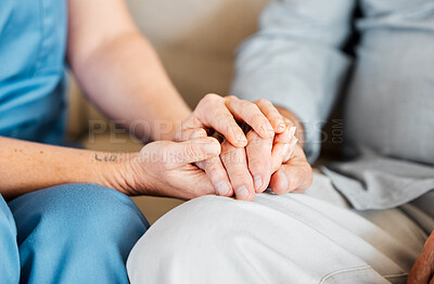 Buy stock photo Closeup shot of an unrecognisable nurse holding a senior man's hand in comfort