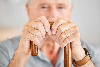 Buy stock photo Hands, senior man and cane for walking in retirement, balance support and mobility by closeup. Home, male pensioner and old person with disability for arthritis, rehabilitation and stick in portrait