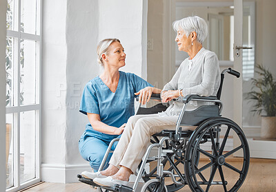 Buy stock photo Shot of a nurse caring for a senior woman in a wheelchair in a retirement home