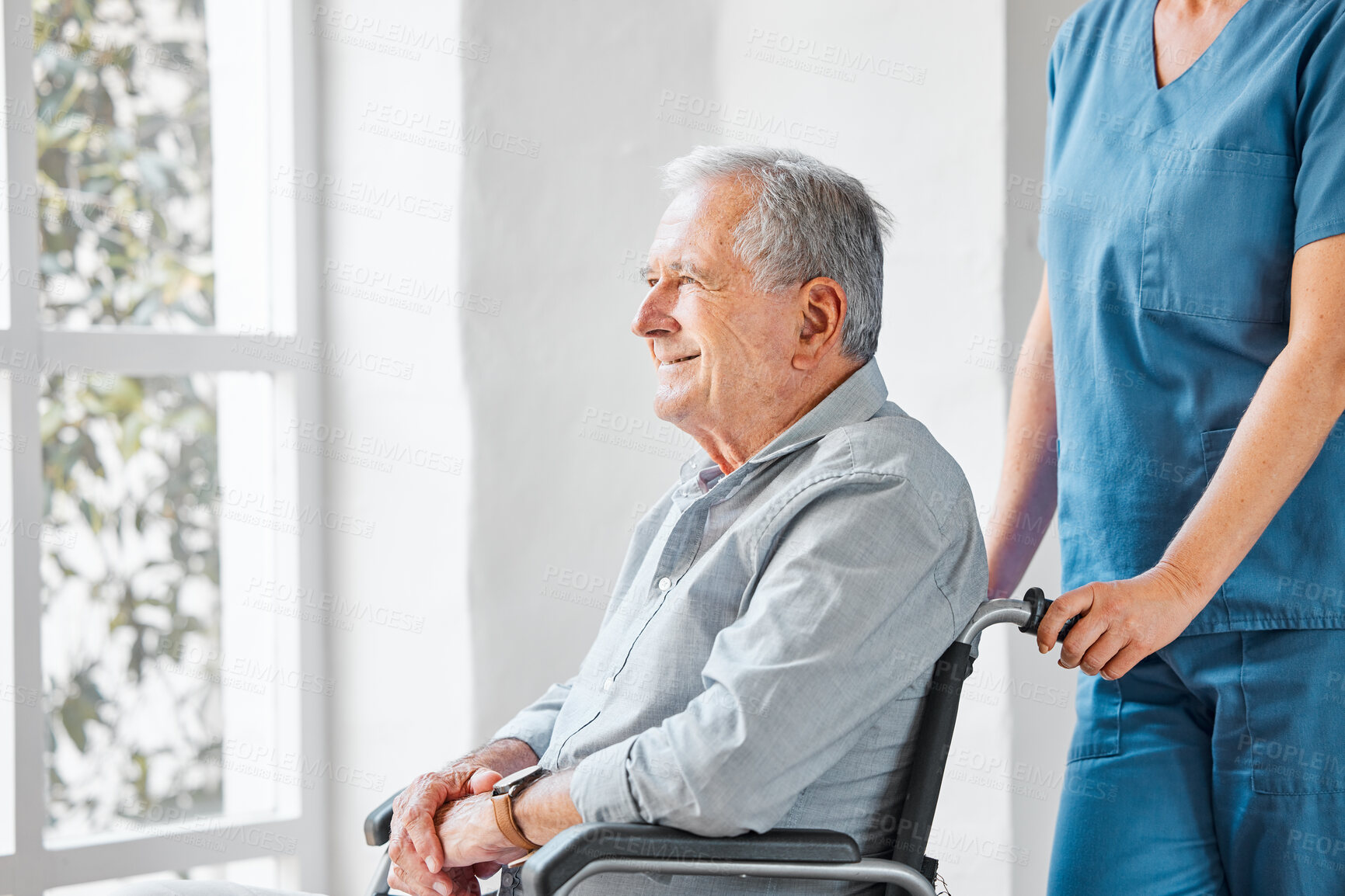 Buy stock photo Shot of a nurse caring for a senior man in a wheelchair in a retirement home