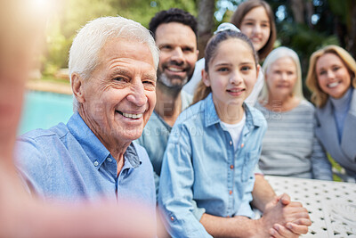 Buy stock photo Shot of a multi-generational family posing together outdoors