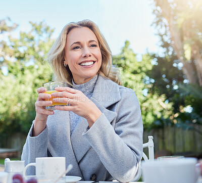 Buy stock photo Shot of a mature woman having breakfast at home