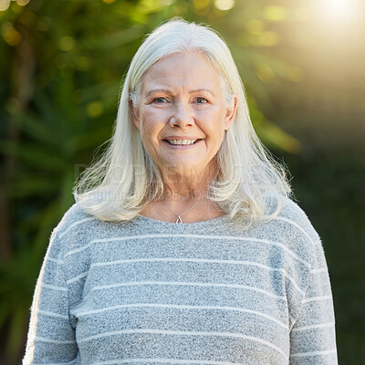 Buy stock photo Shot of a senior woman standing outdoors